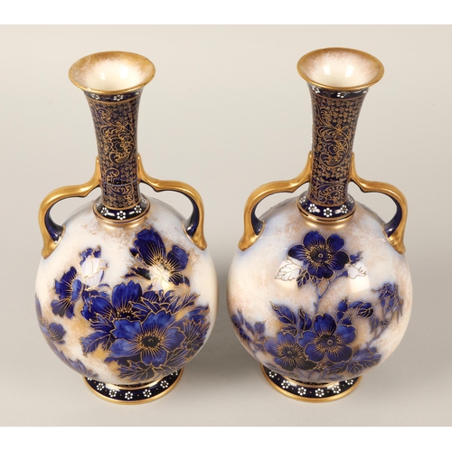 24 - Doulton Burslem pair of blue gilt twin handled vases(Damaged)