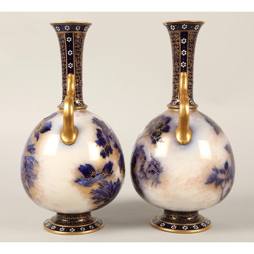 24 - Doulton Burslem pair of blue gilt twin handled vases(Damaged)