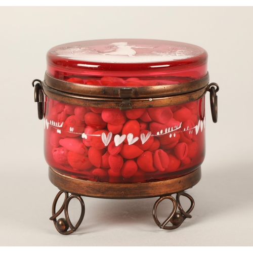 25 - Mary Gregory cranberry glass jar, contains large quantity of small shells, 9cm h x 9cm d