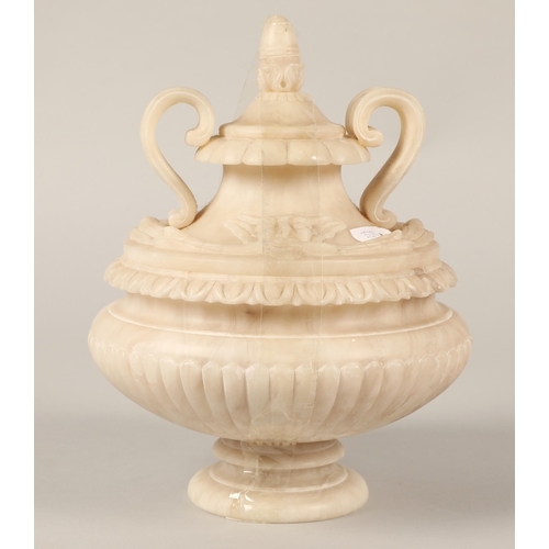 32 - Alabaster twin handled lidded urn, 22cm h