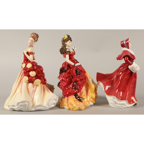 5 - Three Royal Doulton figurines to include Autumn Ball HN5465, The Skater HN3439, and Belle HN370... 