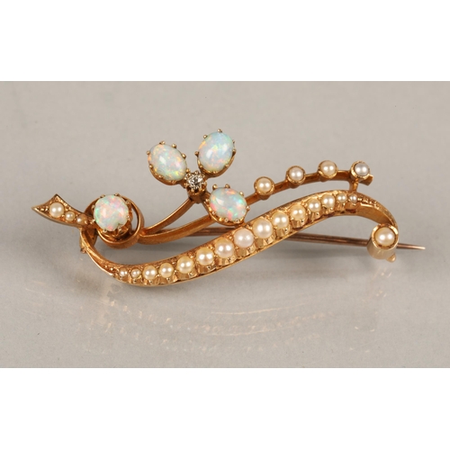 51 - 15ct gold brooch set with seed pearls, opals, and a diamond, 7.6g