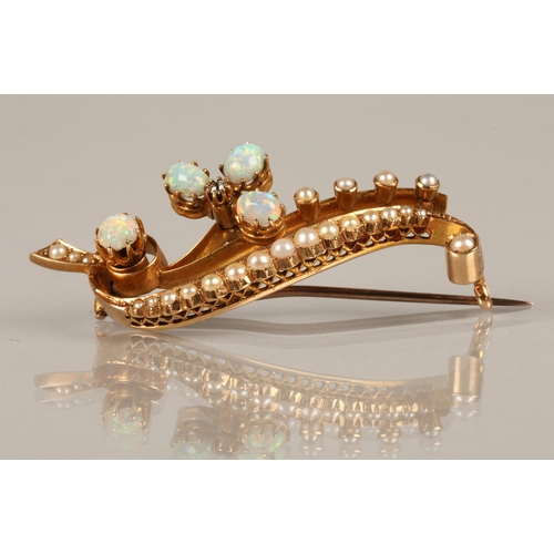 51 - 15ct gold brooch set with seed pearls, opals, and a diamond, 7.6g