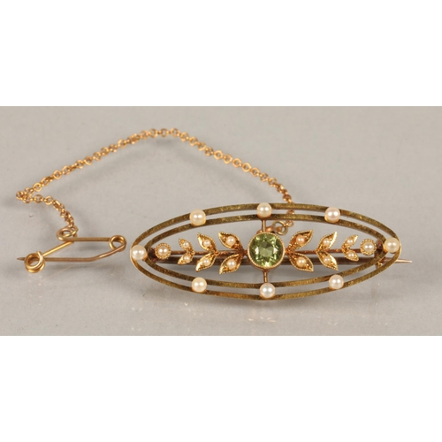 53 - 15ct gold Edwardian brooch set with seed pearls and  peridot, 4g