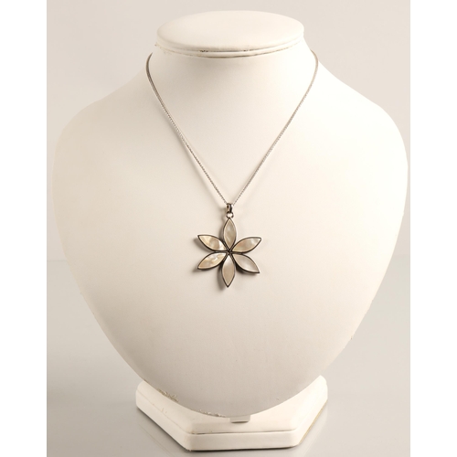 73 - Silver flower necklace inlaid with mother of pearl, a silver celtic cross necklace, and a silver ban... 