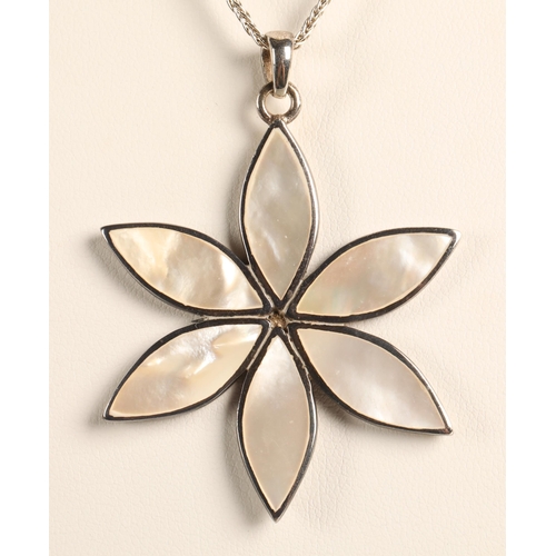 73 - Silver flower necklace inlaid with mother of pearl, a silver celtic cross necklace, and a silver ban... 