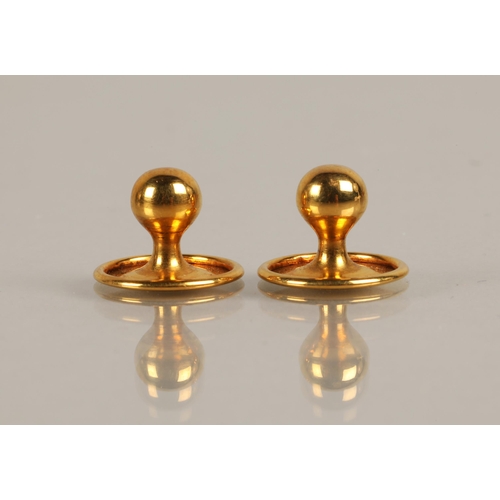 79 - Two 9ct gold button studs, 0.97g