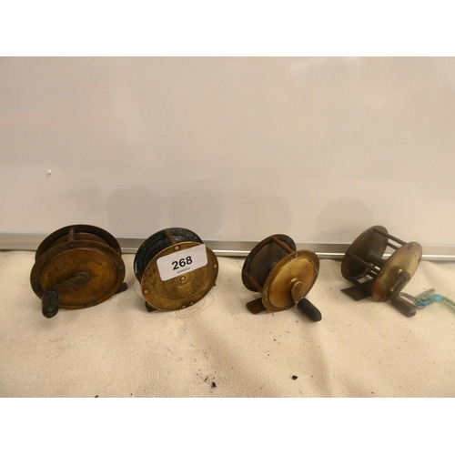 268 - Four antique brass fly fishing reels.