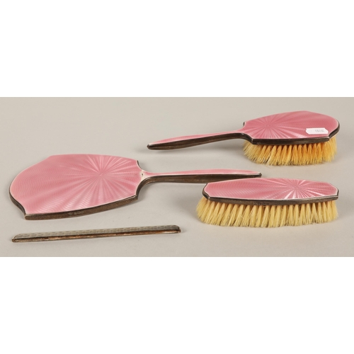 169 - Three piece pink enamelled silver vanity set, comb missing from mount, Birmingham 1913 or 1938