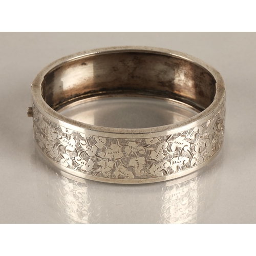 104 - Silver bangle with ivy leaf design, 23.7g