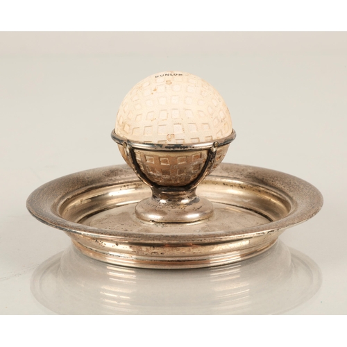 196 - Silver ash tray with a vintage Dunlop golf ball mounted in the centre, Birmingham 1936