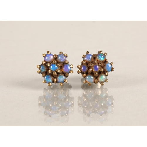 124 - Pair of opal set yellow metal stud earrings