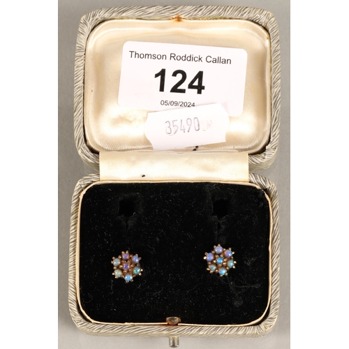 124 - Pair of opal set yellow metal stud earrings