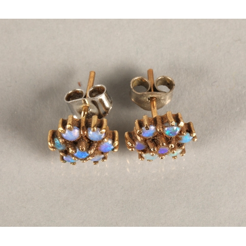 124 - Pair of opal set yellow metal stud earrings