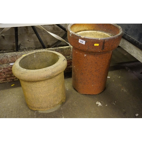 579 - Two chimney cans.