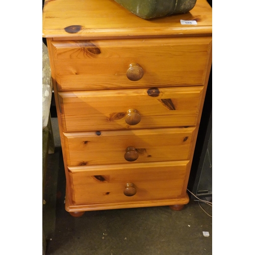 586 - Pine bedside chest of four drawers.