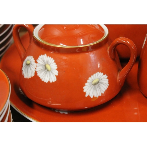 103 - Noritake china tea set, the red brown ground decorated with flowers.