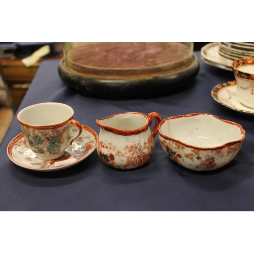 41 - Japanese Kutani cup and saucer, milk jug and small sugar bowl.