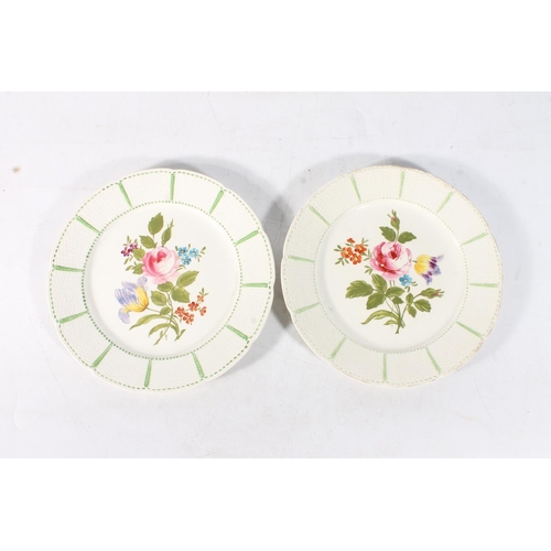 49 - Pair of Wedgwood plates with basket weave effect border framing central hand painted floral sprays, ... 