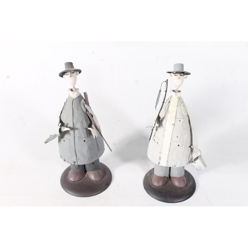 69 - Pair of Sam Toft style painted metal figures of a fisherman and hunter.