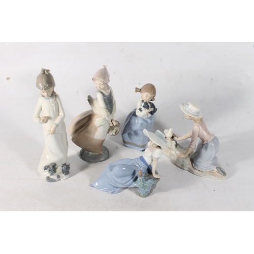 76 - Five Nao by Lladro porcelain figures to include #0267 Caressing the Dove, #1029 Girl with Sleepy Pup... 