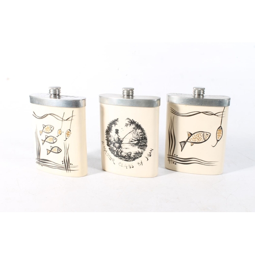 82 - Three Julian Francis pottery fishing themed hip flasks.