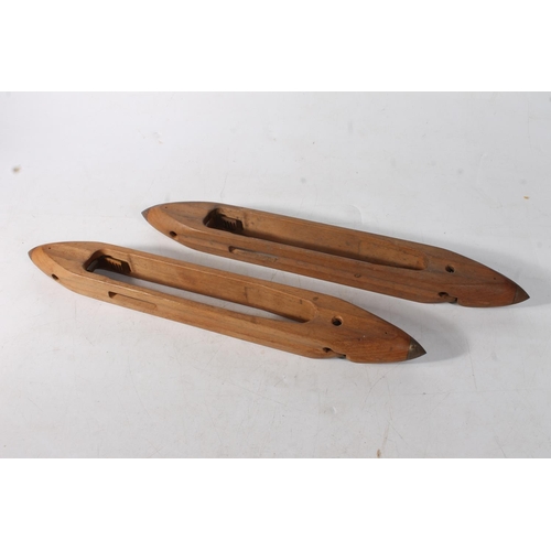 84 - Two wooden weaving shuttles.