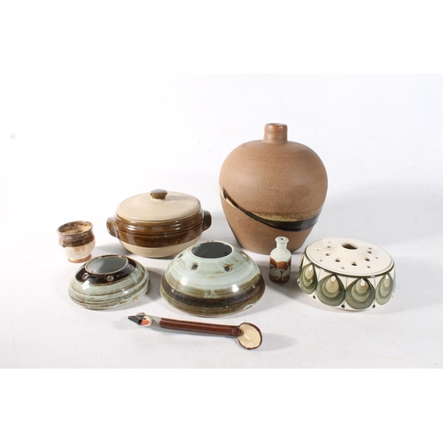 93 - Studio Pottery to include a large lamp base, a covered bowl, a pot, a spoon, and flower/incense hold... 