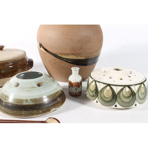 93 - Studio Pottery to include a large lamp base, a covered bowl, a pot, a spoon, and flower/incense hold... 