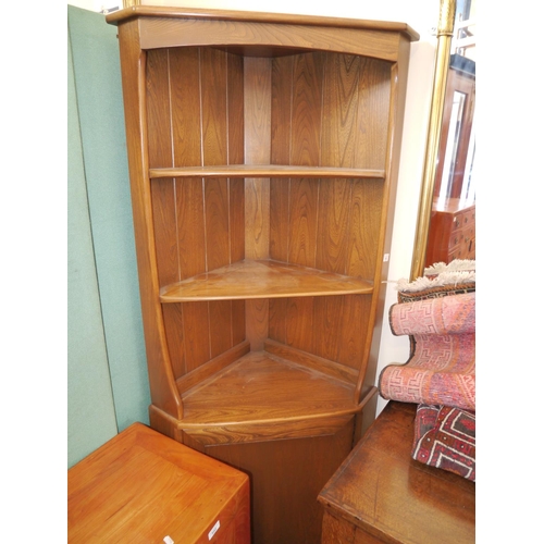 593 - Ercol dark elm corner cabinet, 180cm high.