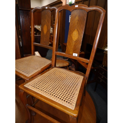 599 - Pair of wicker seated mahogany dining chairs