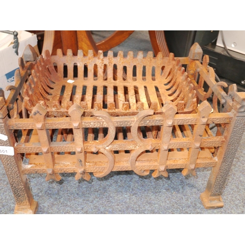 601 - Two cast iron fire baskets.