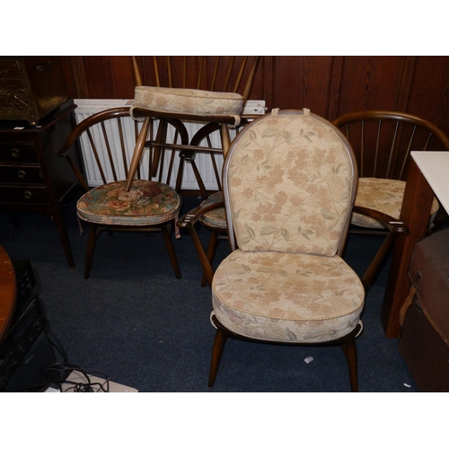 603 - Four Ercol cowhorn chairs and a Ercol armchair.