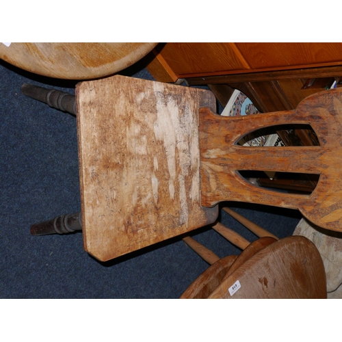 611 - Farmhouse style low chair with incised decoration, H71cm.