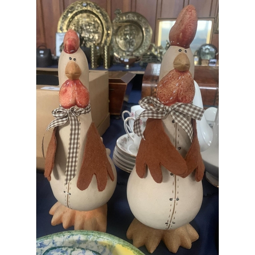 69A - Two comical pottery chickens.