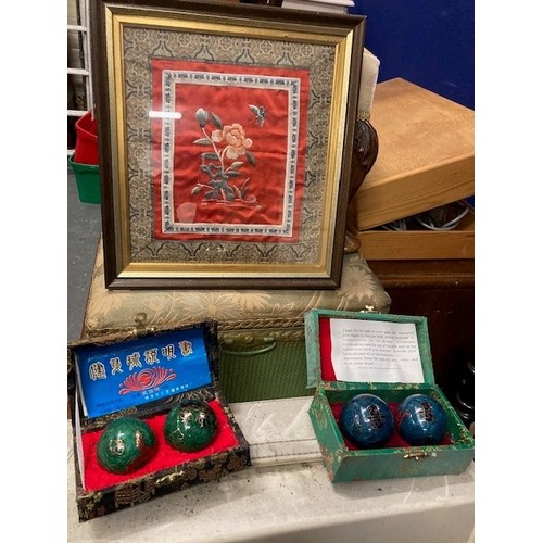 324 - Oriental framed silk floral picture and two cased sets of Chinese health balls.