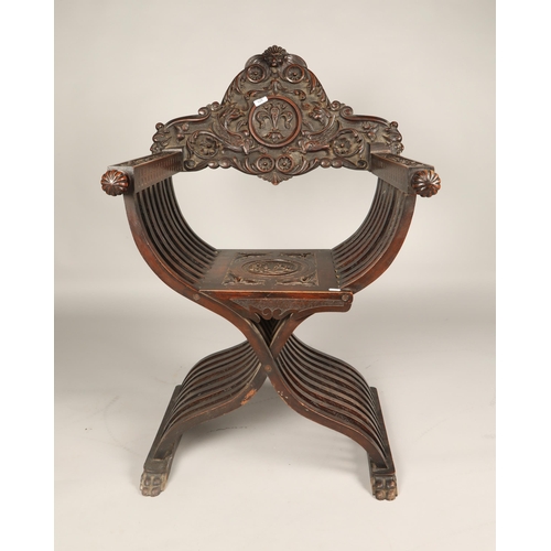 601 - Italian style carved oak Savonarola style chair., 108cm high