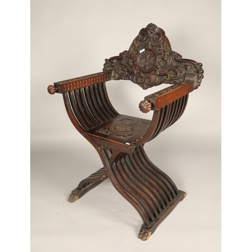 601 - Italian style carved oak Savonarola style chair., 108cm high