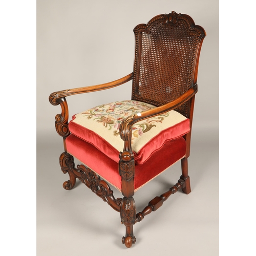 603 - Heavily carved bergere back upholstered open armchair