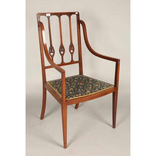 606 - Edwardian inlaid floral upholstered armchair with carved foliage design to splat