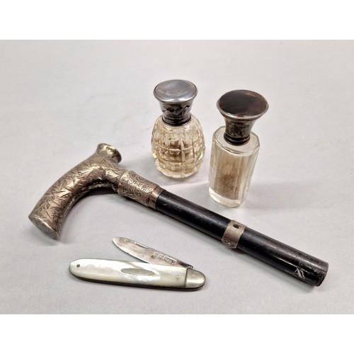 225 - Two smelling salt bottles with white metal caps, one with tortoiseshell, walking cane handle dated 1... 