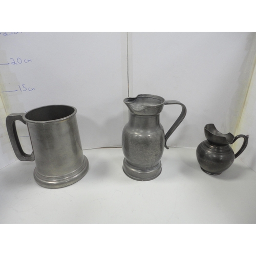 102 - Group of antique pewter to include tappit hen, jug, candlesticks, plate, tankard and a cruisie lamp ... 