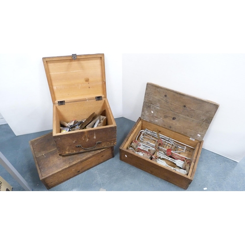 183 - Two wooden crates containing Gipron roller skates, also tools, chisels etc., and another empty crate... 