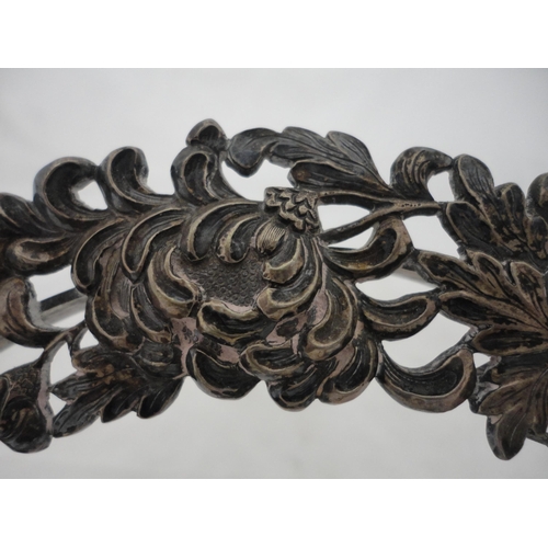 187 - White metal embossed circular photograph frame on an easel support stand.