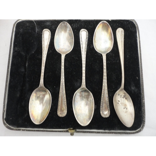 195 - Five matching silver sugar spoons, cased.