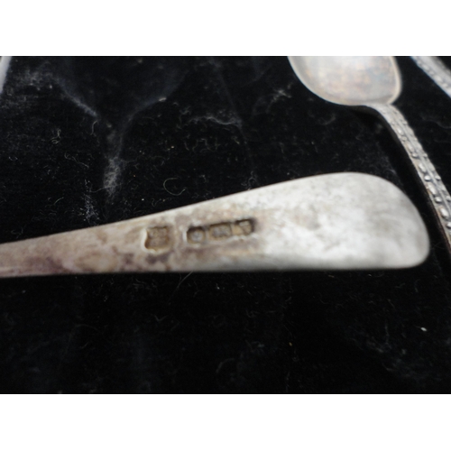 195 - Five matching silver sugar spoons, cased.