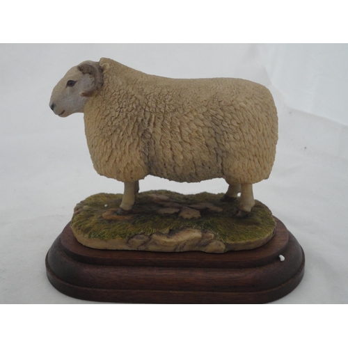 199 - Three Border Fine Arts groups to include a Highland cow and calf, a Cheviot ram sculpted by Ray Ayre... 