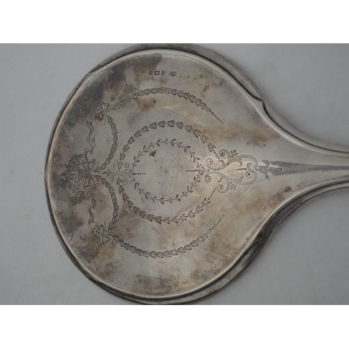 202 - Silver-backed four-piece dressing table set in fitted box.