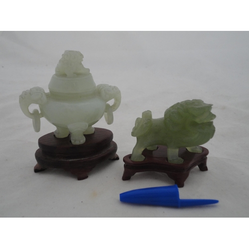 204 - Small Chinese-style jade-coloured censer and cover on stand, and a similar jade-coloured temple dog.... 
