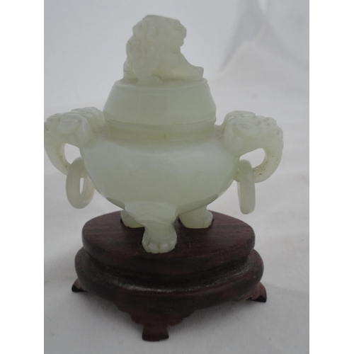 204 - Small Chinese-style jade-coloured censer and cover on stand, and a similar jade-coloured temple dog.... 